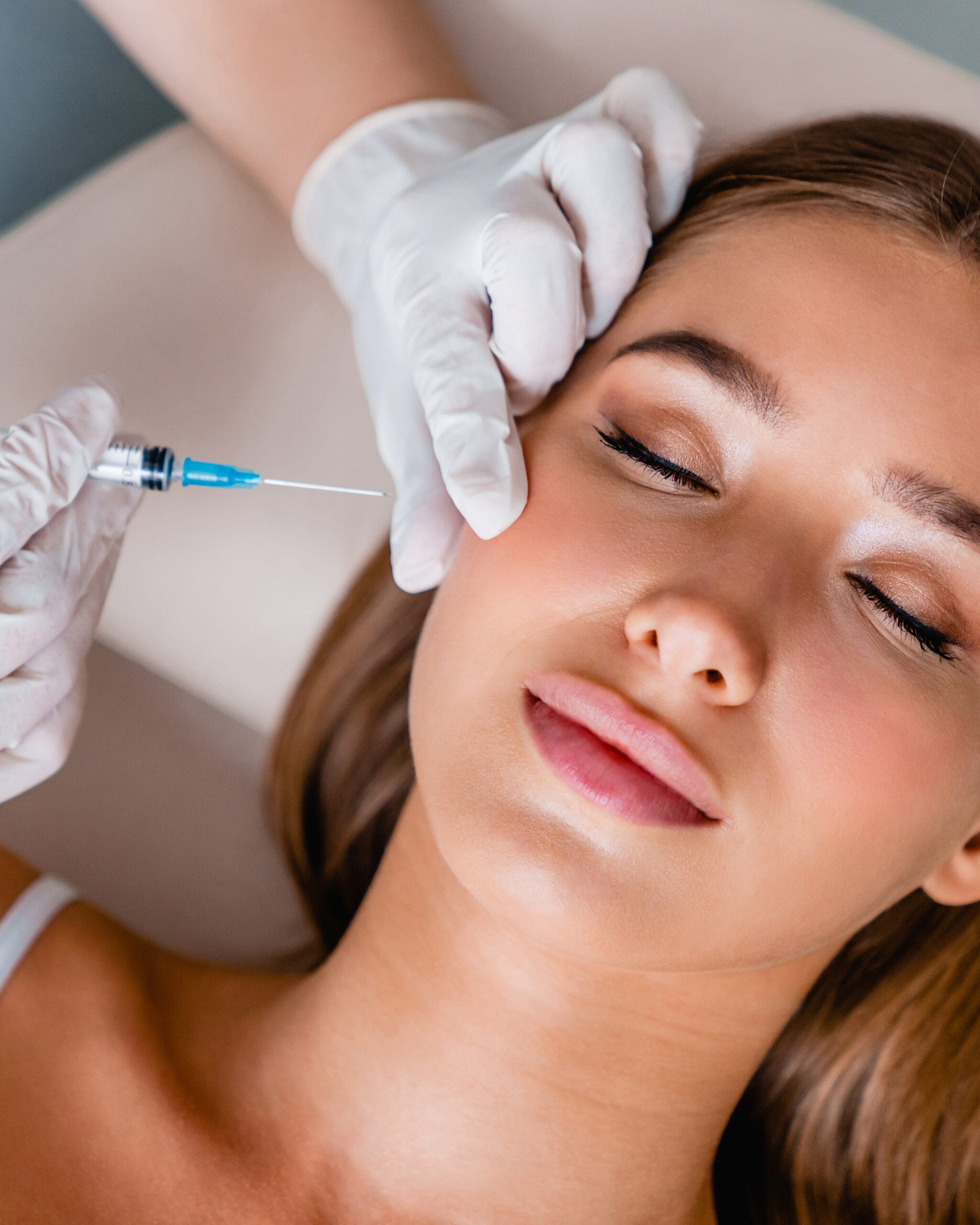 Young woman gets beauty facial injections in salon led caen st contest