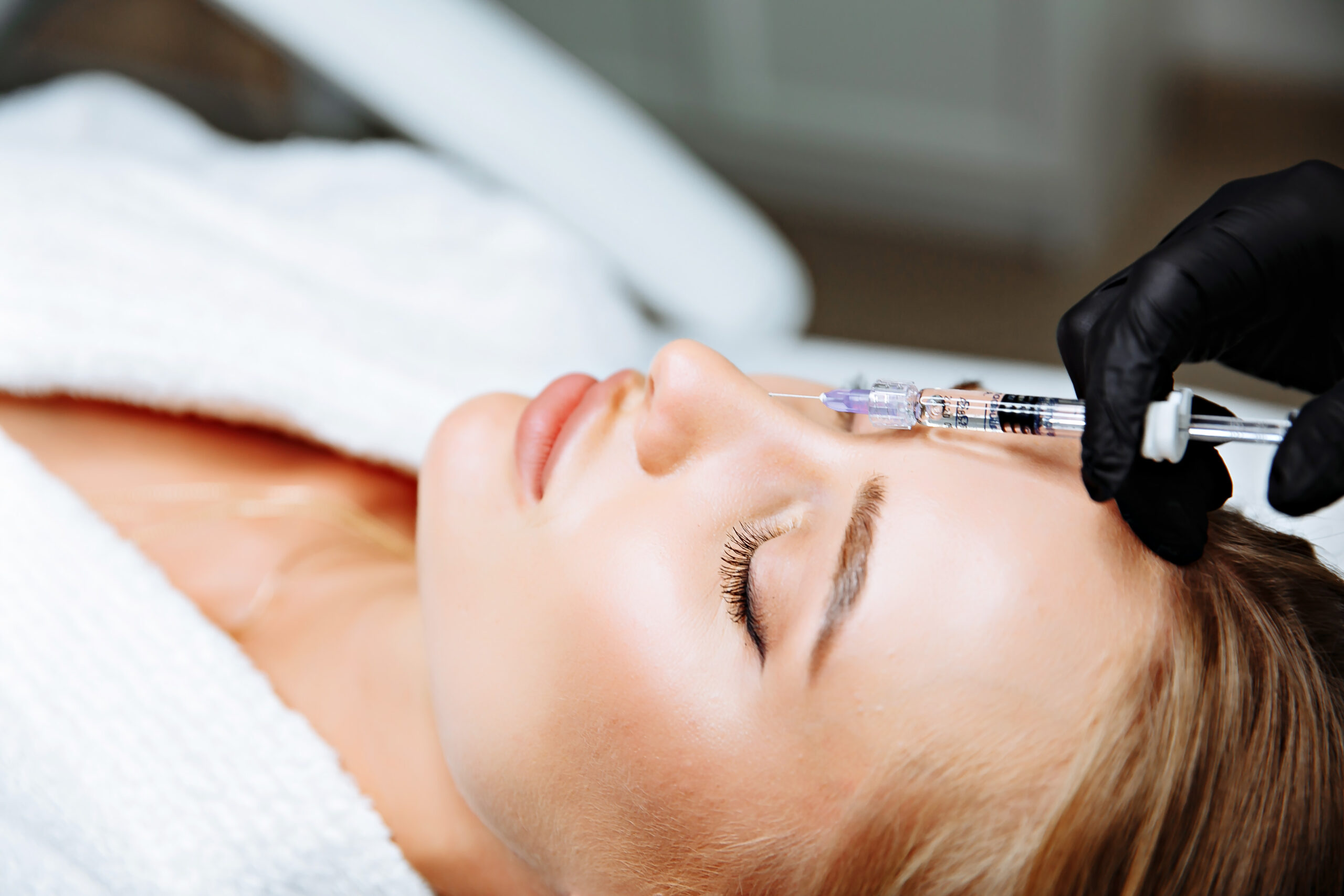 Portrait of female patient having modern noninvasive procedure of rhinoplasty,